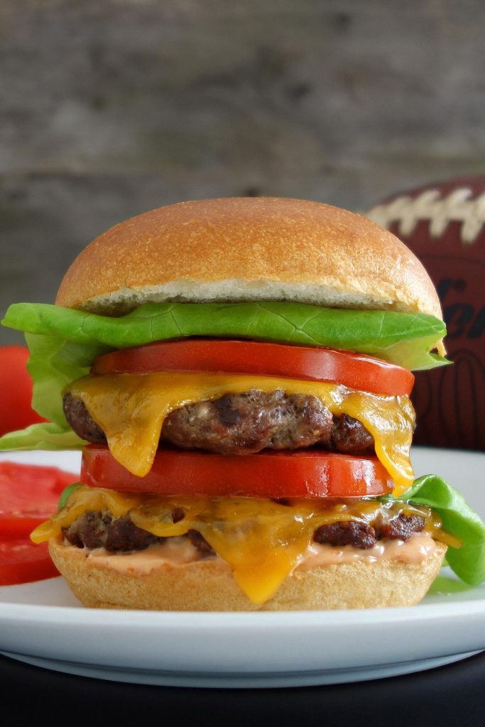 The outstanding double California burger, topped off with fresh lettuce and tomato slices. Perfect for grilling!