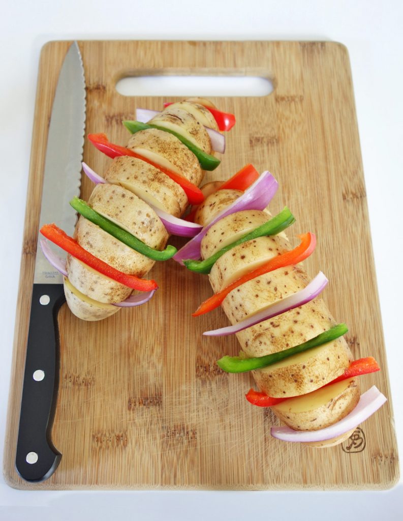 Grilled hasselback potatoes with peppers are easy to make and delicious grilling sides.