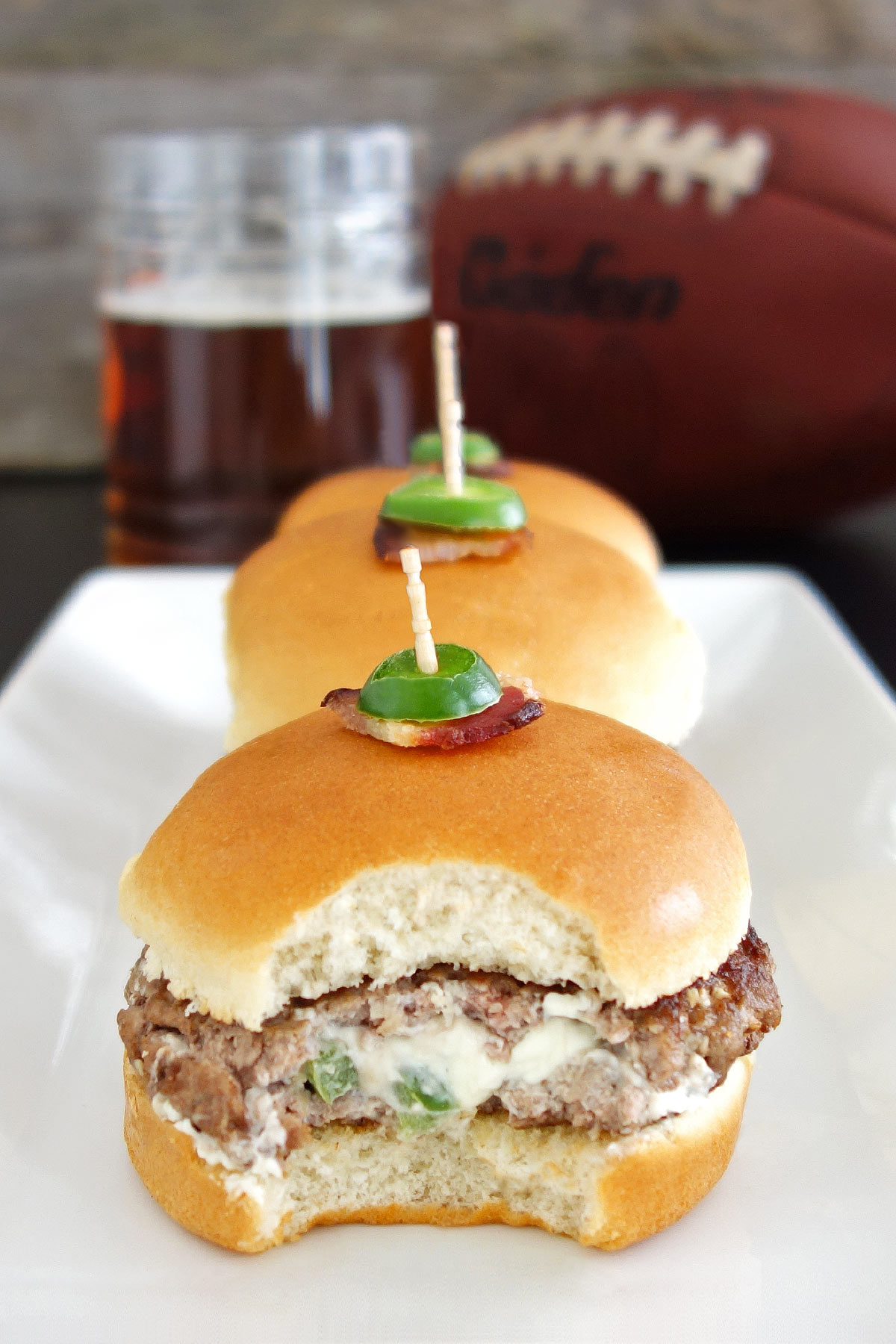 Jalapeño popper stuffed burger sliced open
